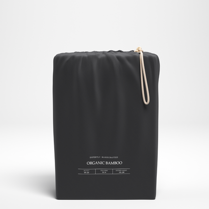Black organic bamboo product packaging on a white background