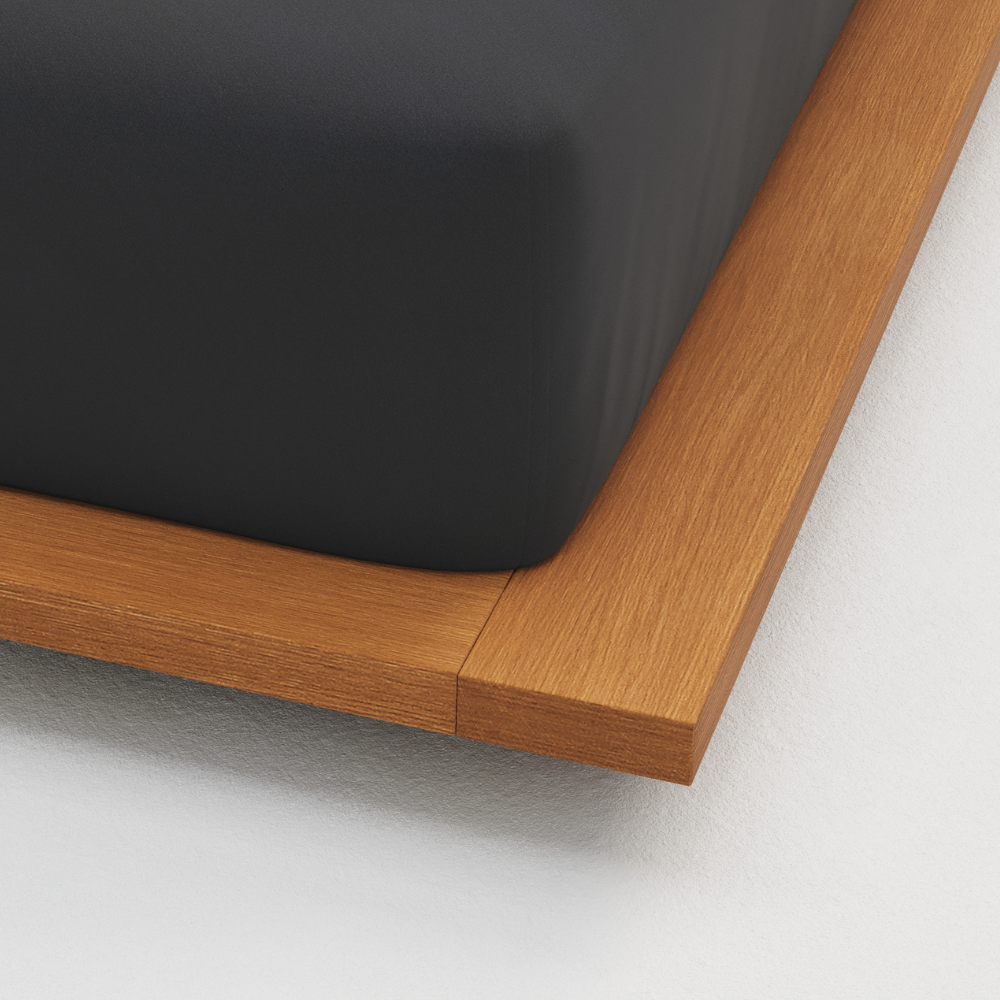 Close-up of a wooden frame corner on a white background